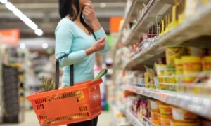 Woman shopping with an orange basket